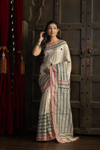 Gachi Tussar with multi colour Katha stitch and mirror work in beige base colour designer saree.