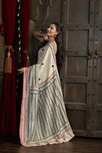 Gachi Tussar with multi colour Katha stitch and mirror work in beige base colour designer saree.