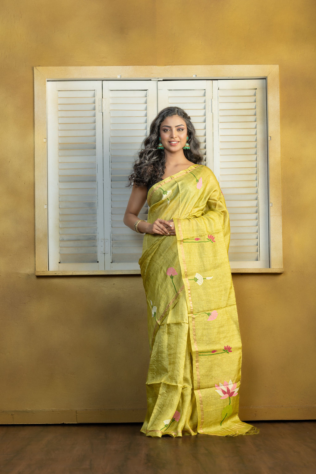 Hand Woven Bengal Tussar with needle work on pista colour base. A elegant vibrant festive drape with timeless craftsmanship.