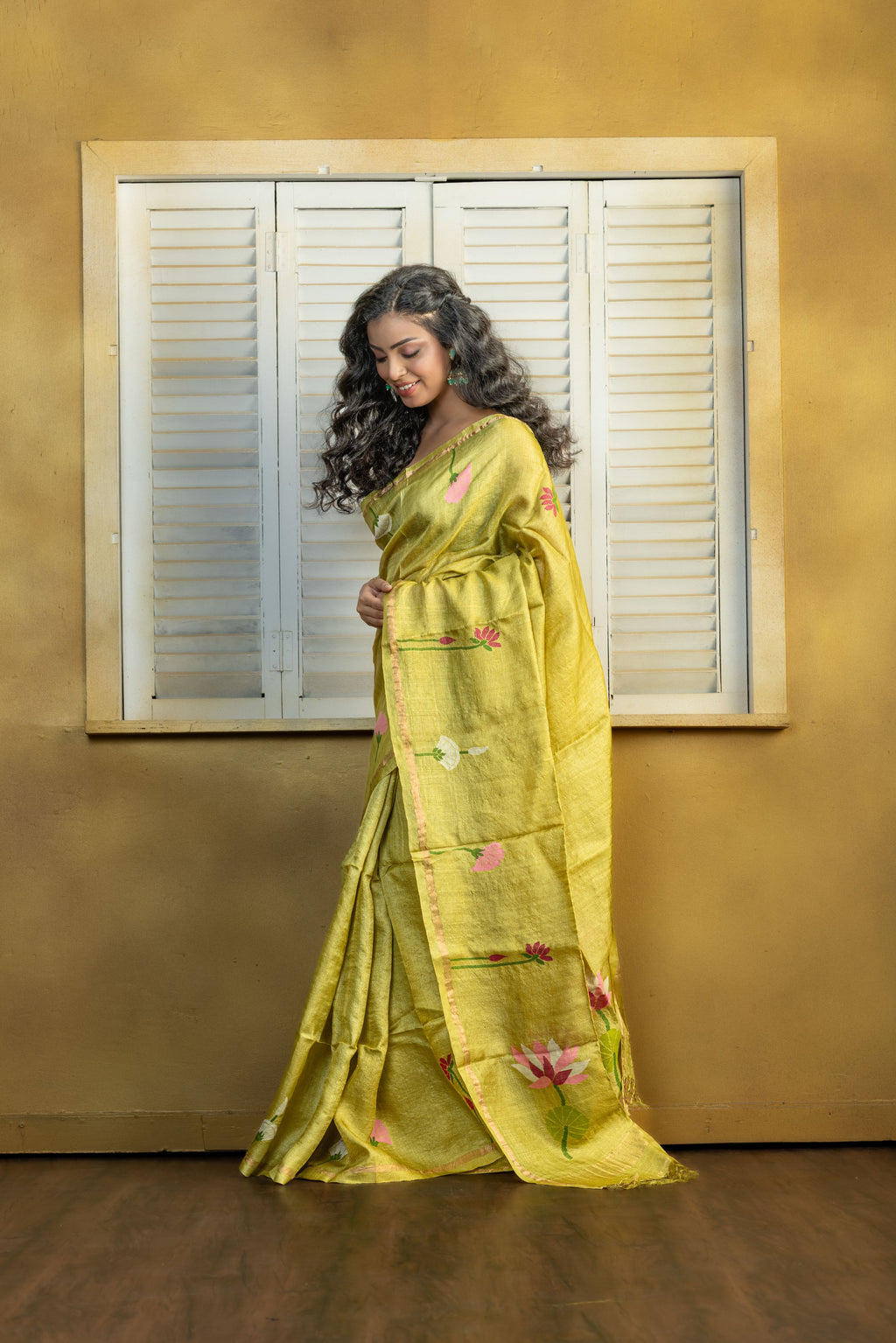 Hand Woven Bengal Tussar with needle work on pista colour base. A elegant vibrant festive drape with timeless craftsmanship.