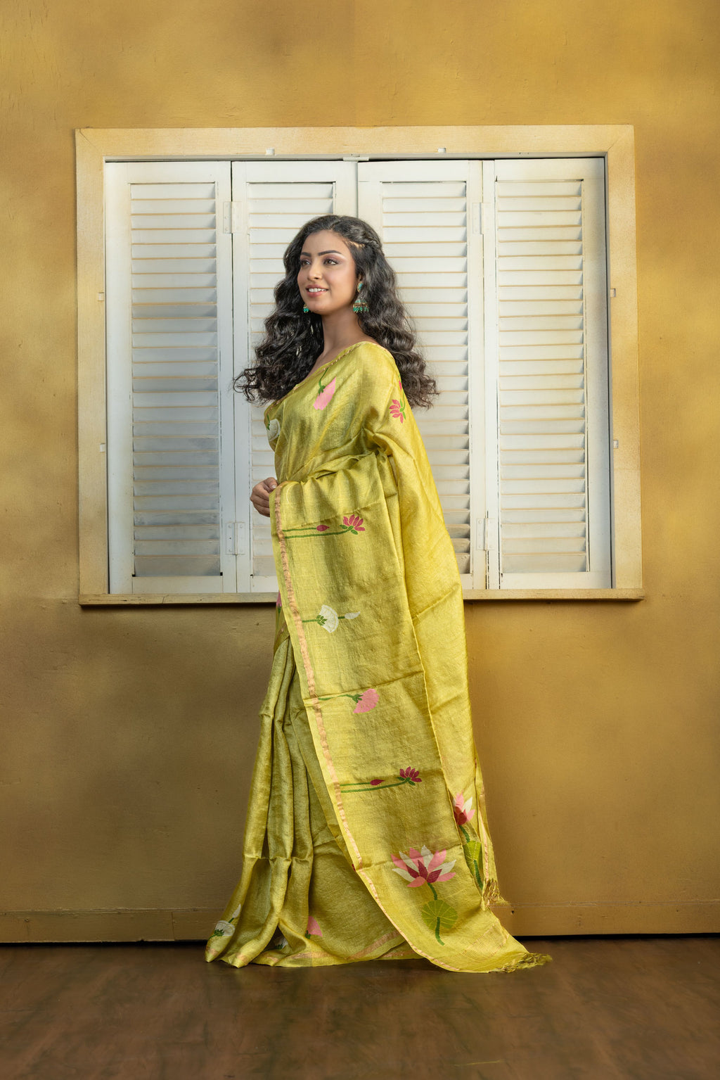Hand Woven Bengal Tussar with needle work on pista colour base. A elegant vibrant festive drape with timeless craftsmanship.