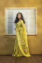 Hand Woven Bengal Tussar with needle work on pista colour base. A elegant vibrant festive drape with timeless craftsmanship.