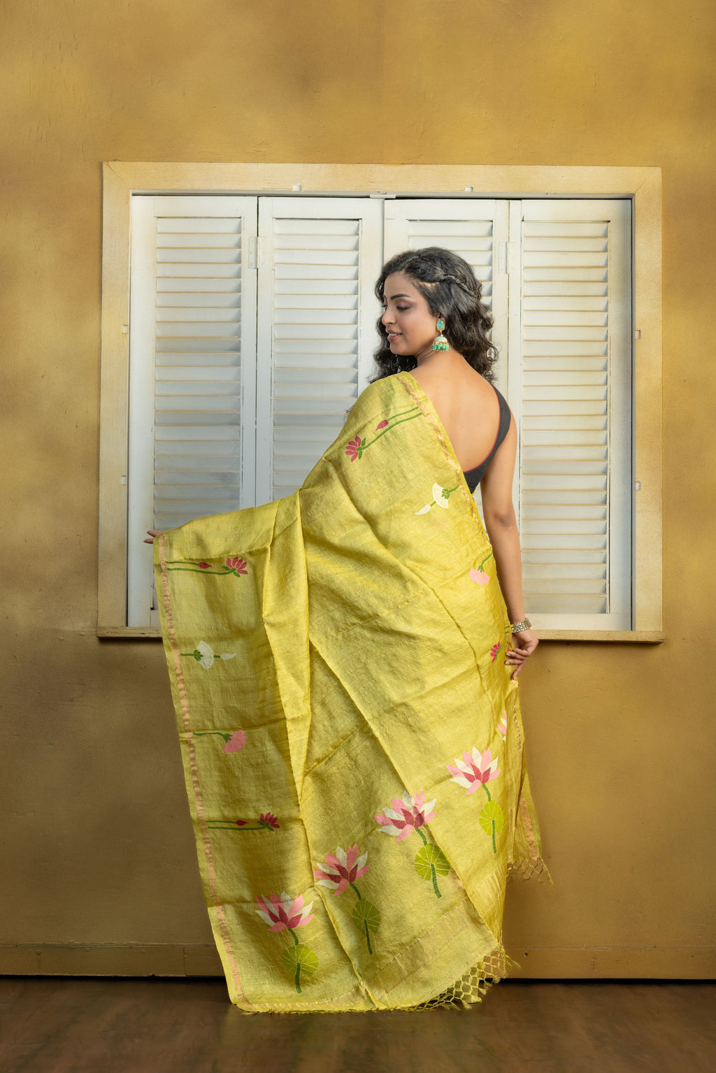 Hand Woven Bengal Tussar with needle work on pista colour base. A elegant vibrant festive drape with timeless craftsmanship.