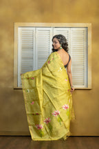 Hand Woven Bengal Tussar with needle work on pista colour base. A elegant vibrant festive drape with timeless craftsmanship.