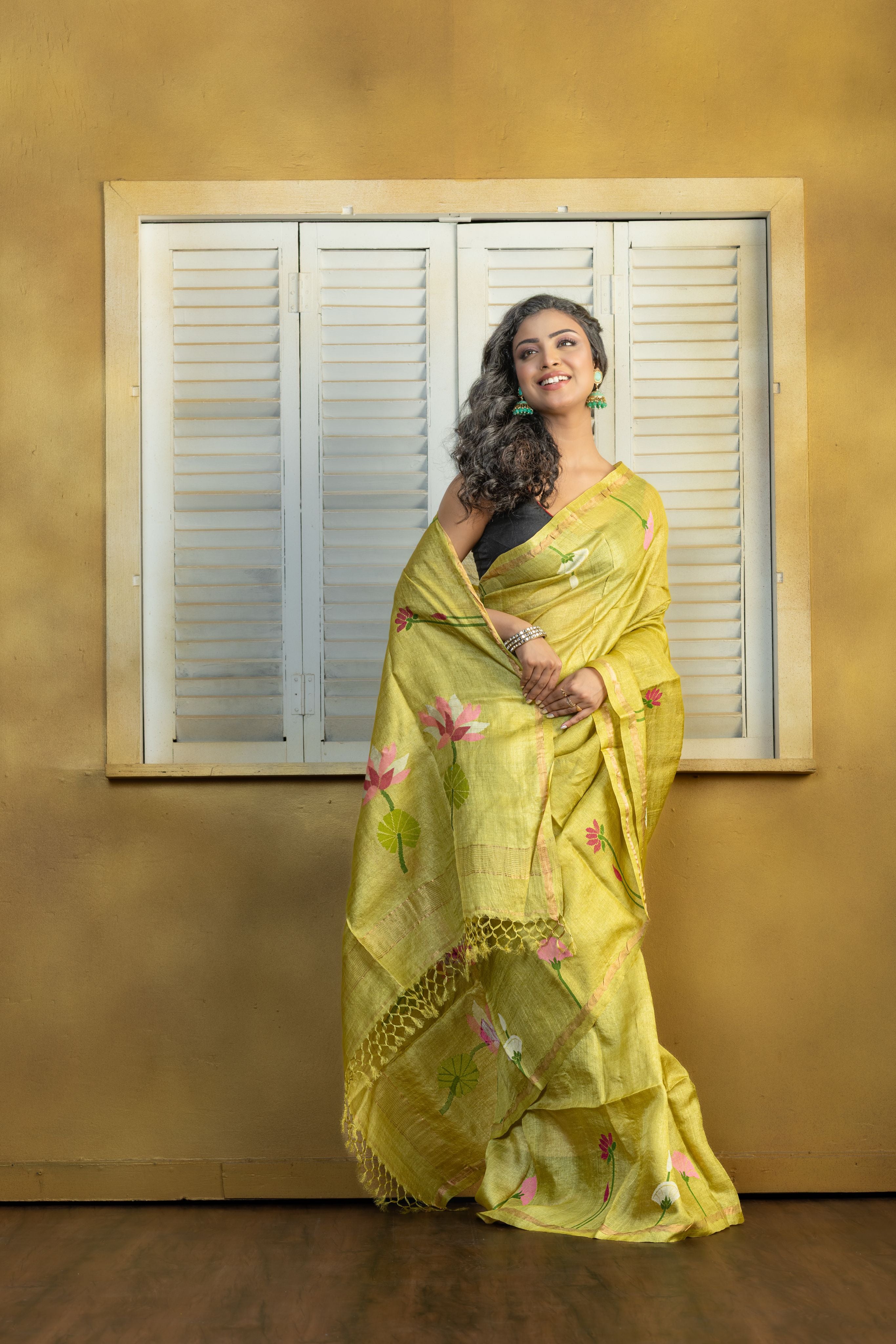 Hand Woven Bengal Tussar with needle work on pista colour base. A elegant vibrant festive drape with timeless craftsmanship.