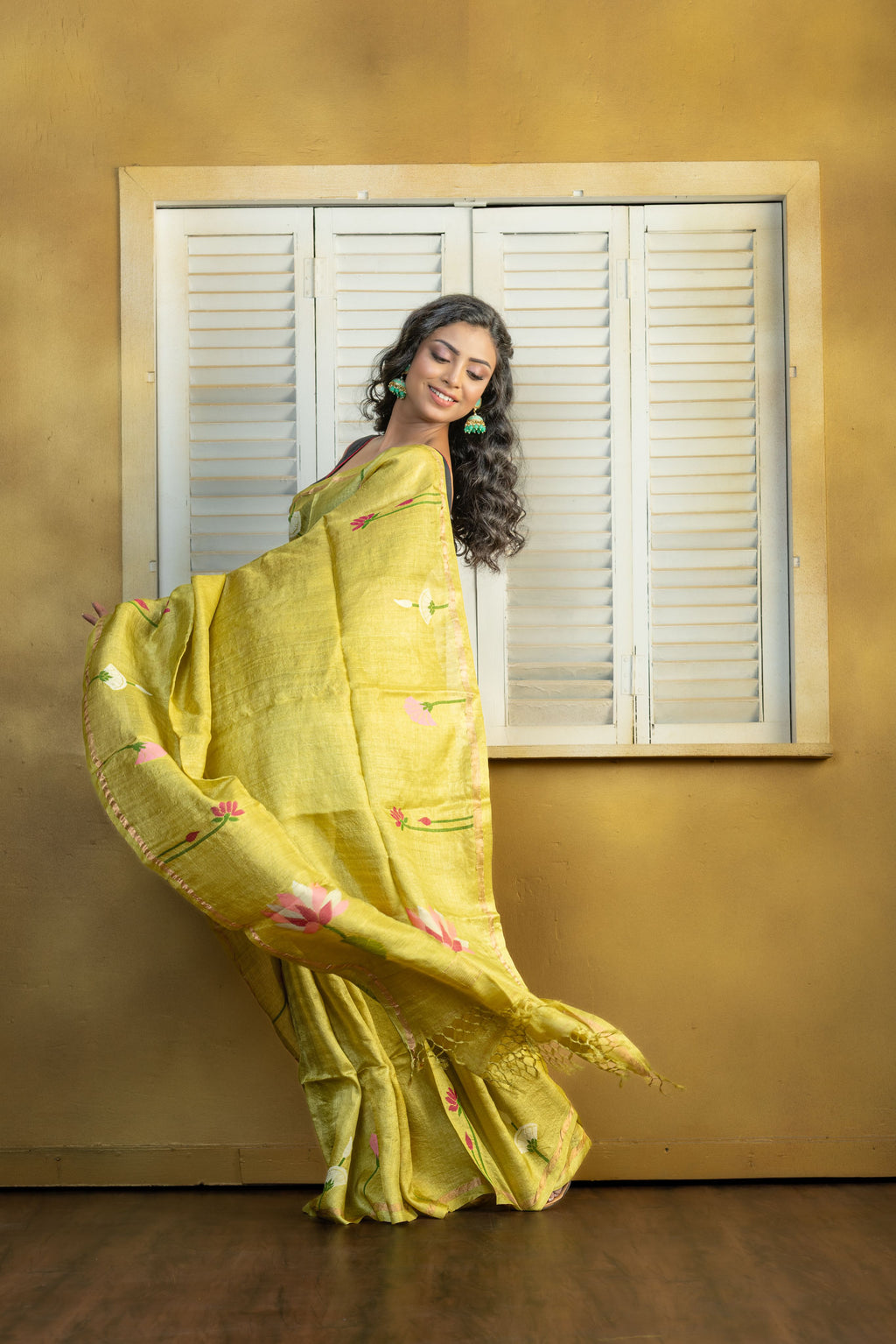 Hand Woven Bengal Tussar with needle work on pista colour base. A elegant vibrant festive drape with timeless craftsmanship.