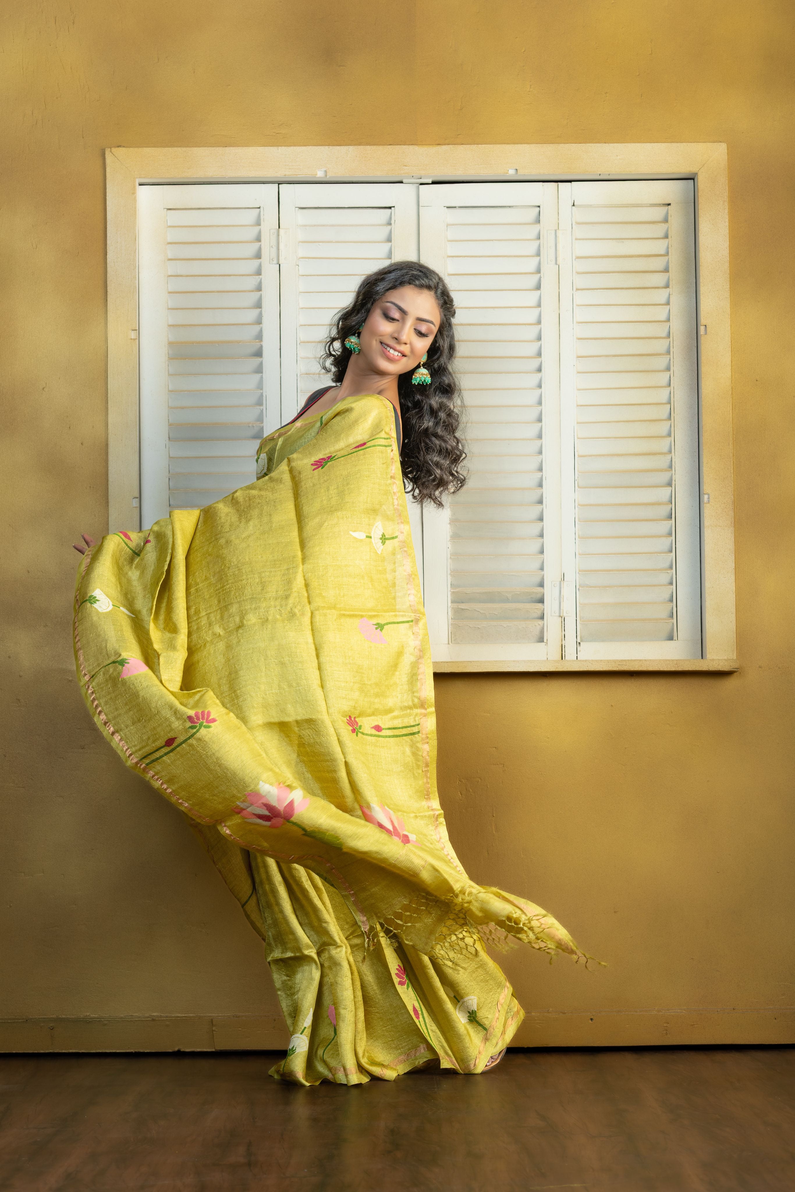 Hand Woven Bengal Tussar with needle work on pista colour base. A elegant vibrant festive drape with timeless craftsmanship.
