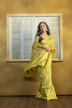 Hand Woven Bengal Tussar with needle work on pista colour base. A elegant vibrant festive drape with timeless craftsmanship.