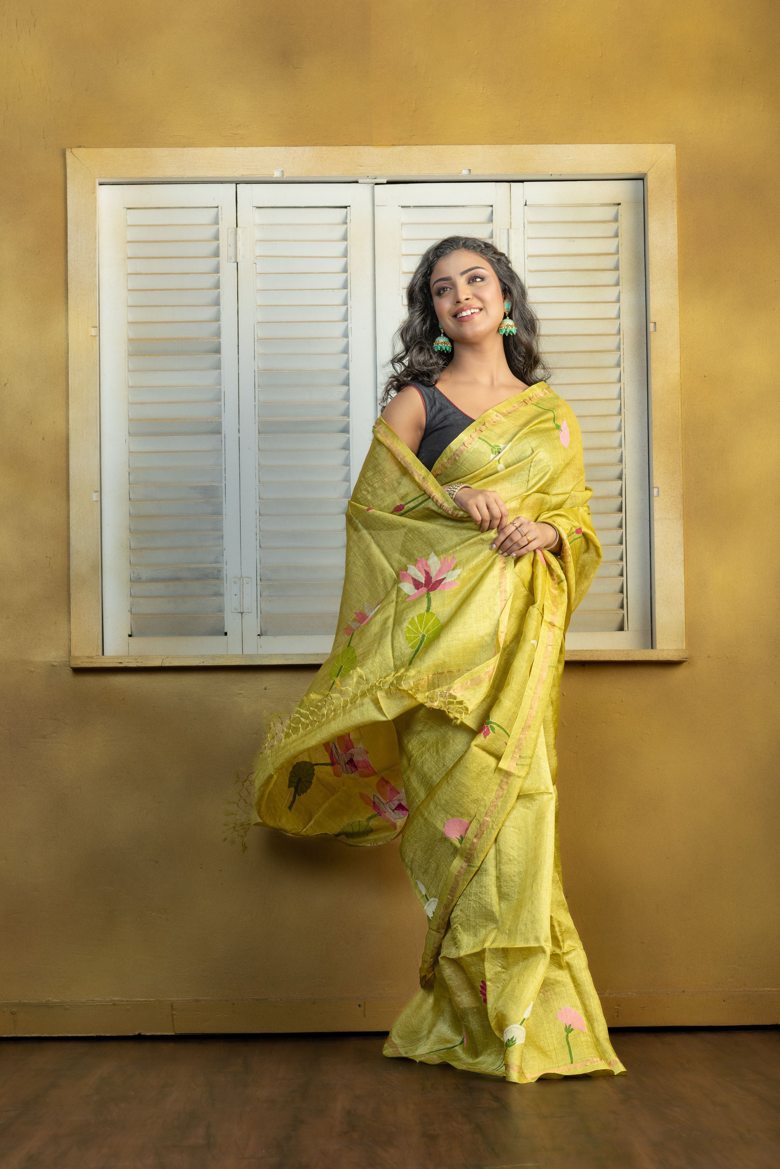 Hand Woven Bengal Tussar with needle work on pista colour base. A elegant vibrant festive drape with timeless craftsmanship.