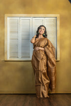 Hand-woven Bengal Tussar with zari border on coffee colour base. A elegant vibrant festive drape with timeless craftsmanship.