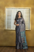 Hand-woven Bengal Tussar all over needle work Buta on black colour base. A elegant vibrant festive drape with timeless craftsmanship.