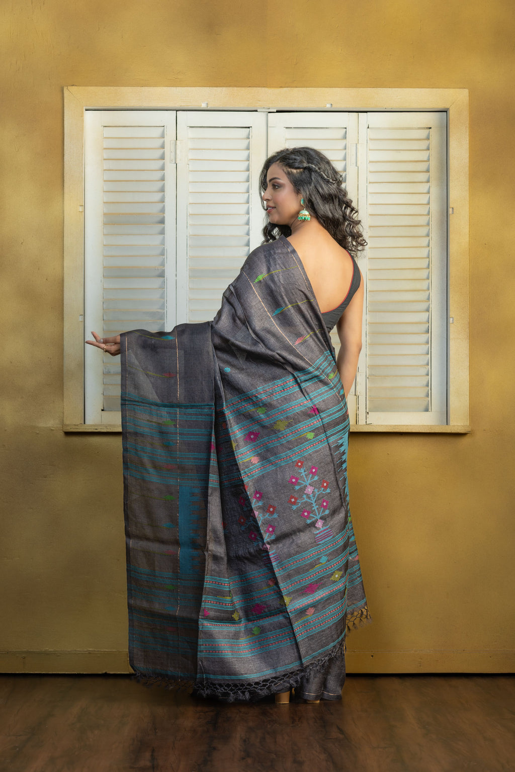 Hand-woven Bengal Tussar all over needle work Buta on black colour base. A elegant vibrant festive drape with timeless craftsmanship.