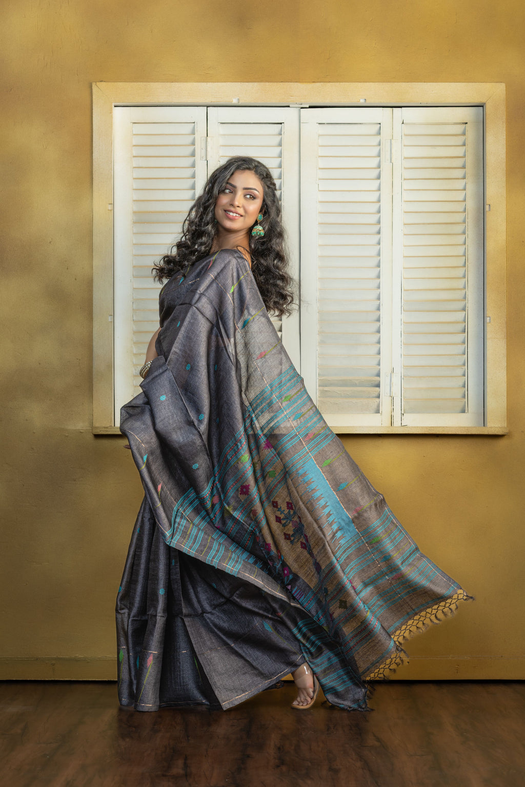 Hand-woven Bengal Tussar all over needle work Buta on black colour base. A elegant vibrant festive drape with timeless craftsmanship.