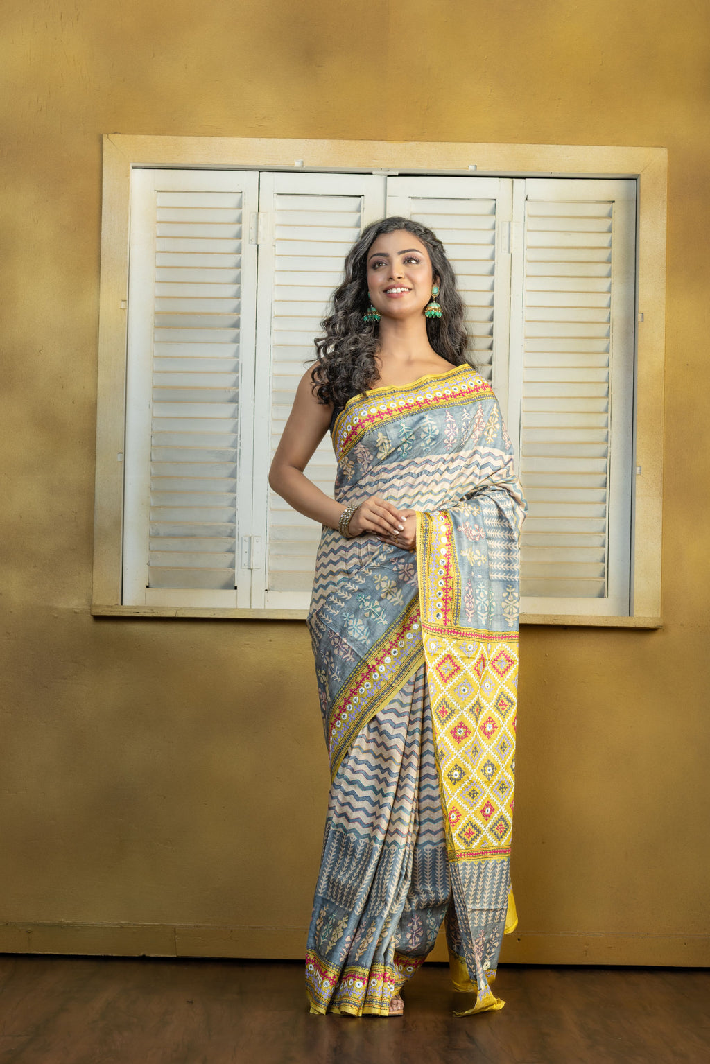 by Gachi Tussar block print with Gujarati mirror handwork work grey base colour designer saree
