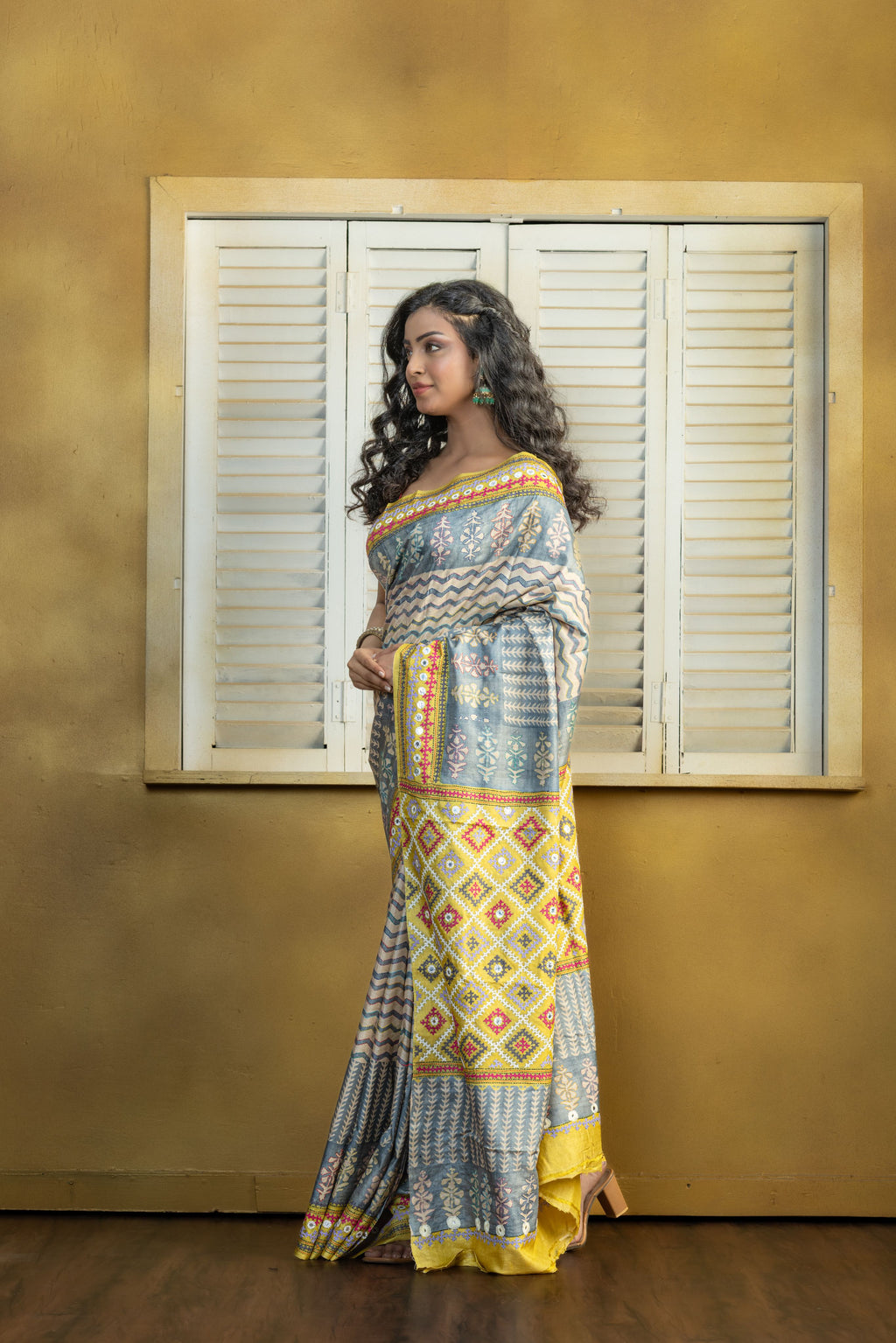 by Gachi Tussar block print with Gujarati mirror handwork work grey base colour designer saree