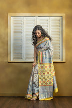 by Gachi Tussar block print with Gujarati mirror handwork work grey base colour designer saree