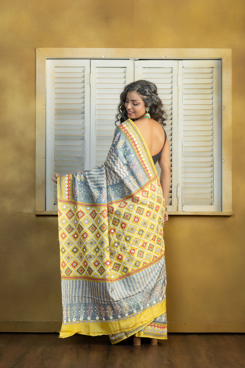 by Gachi Tussar block print with Gujarati mirror handwork work grey base colour designer saree