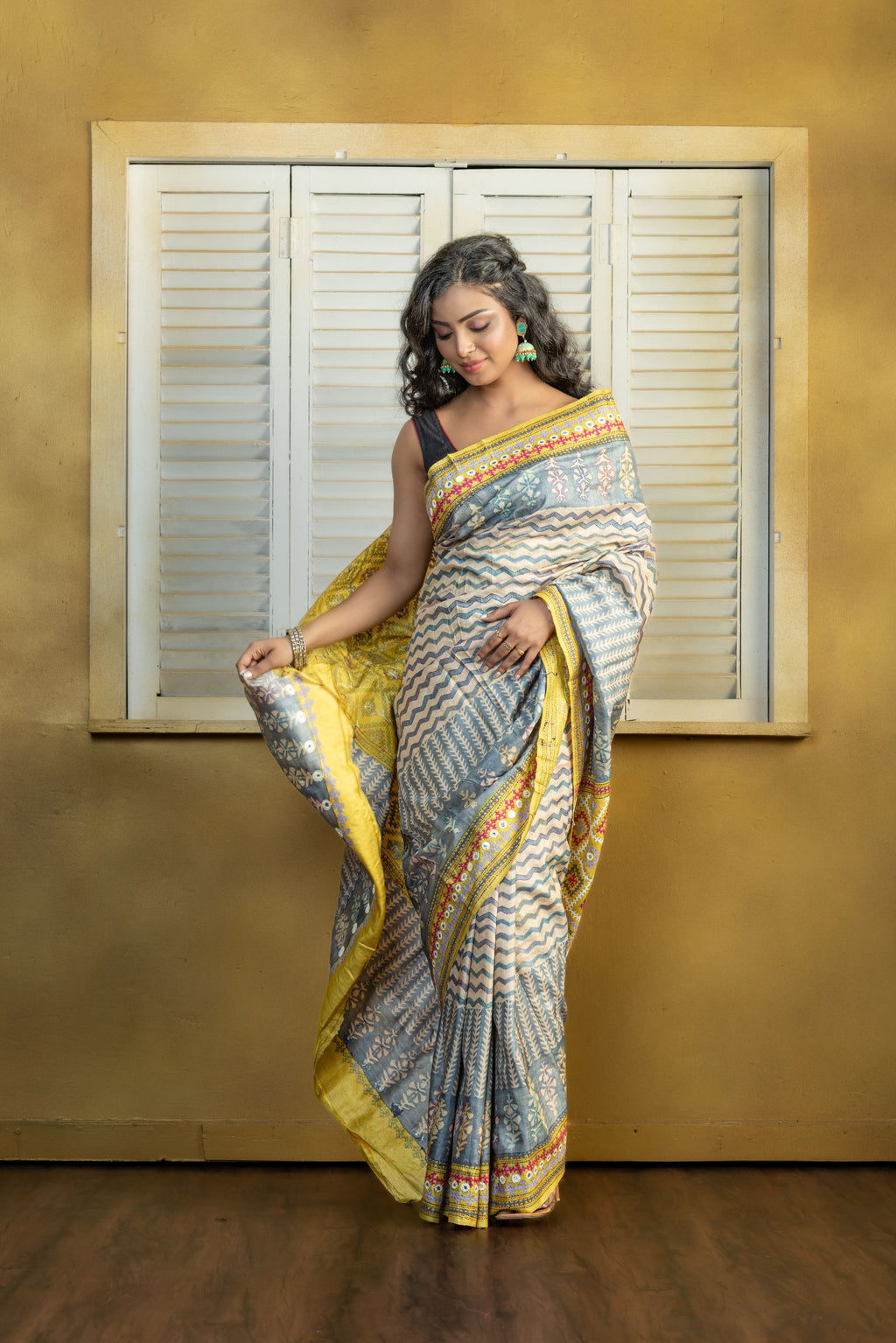 by Gachi Tussar block print with Gujarati mirror handwork work grey base colour designer saree
