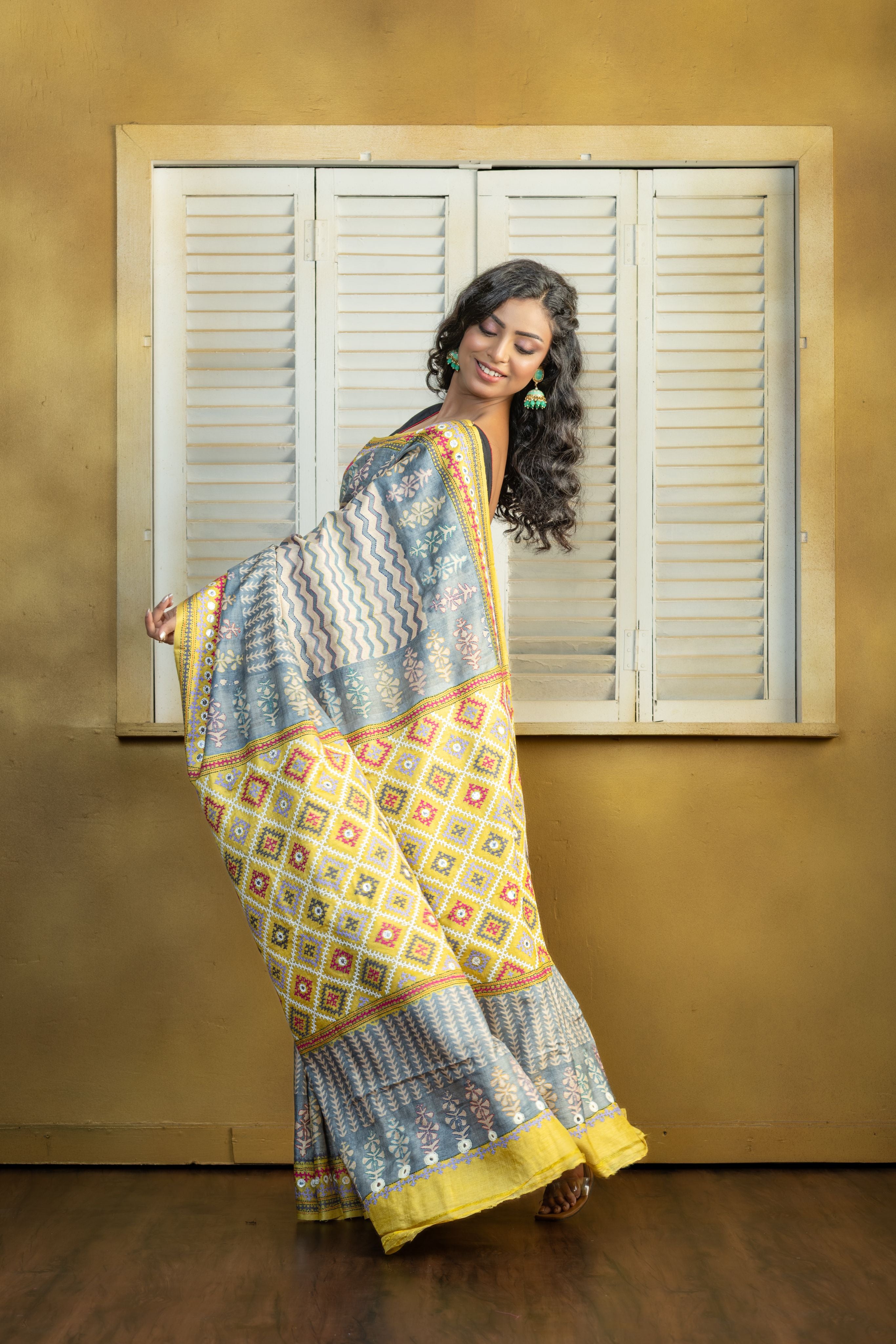 by Gachi Tussar block print with Gujarati mirror handwork work grey base colour designer saree